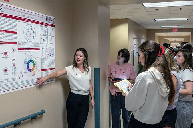 Students presenting at RBC Symposium